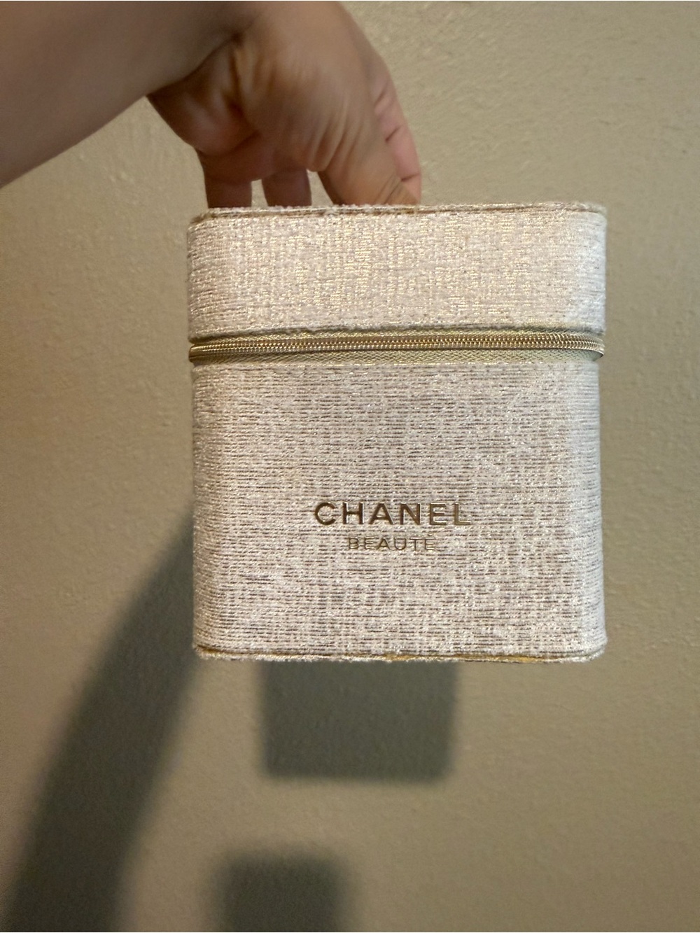 CHANEL Cream Textured Zippered Beauty Case with Gold Accents